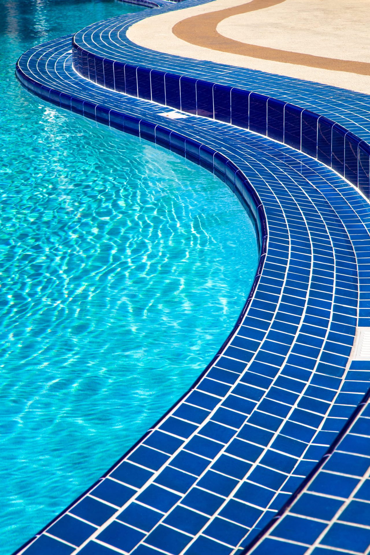 Crystal-clear water over designer mosaic tiling at a Sandton home