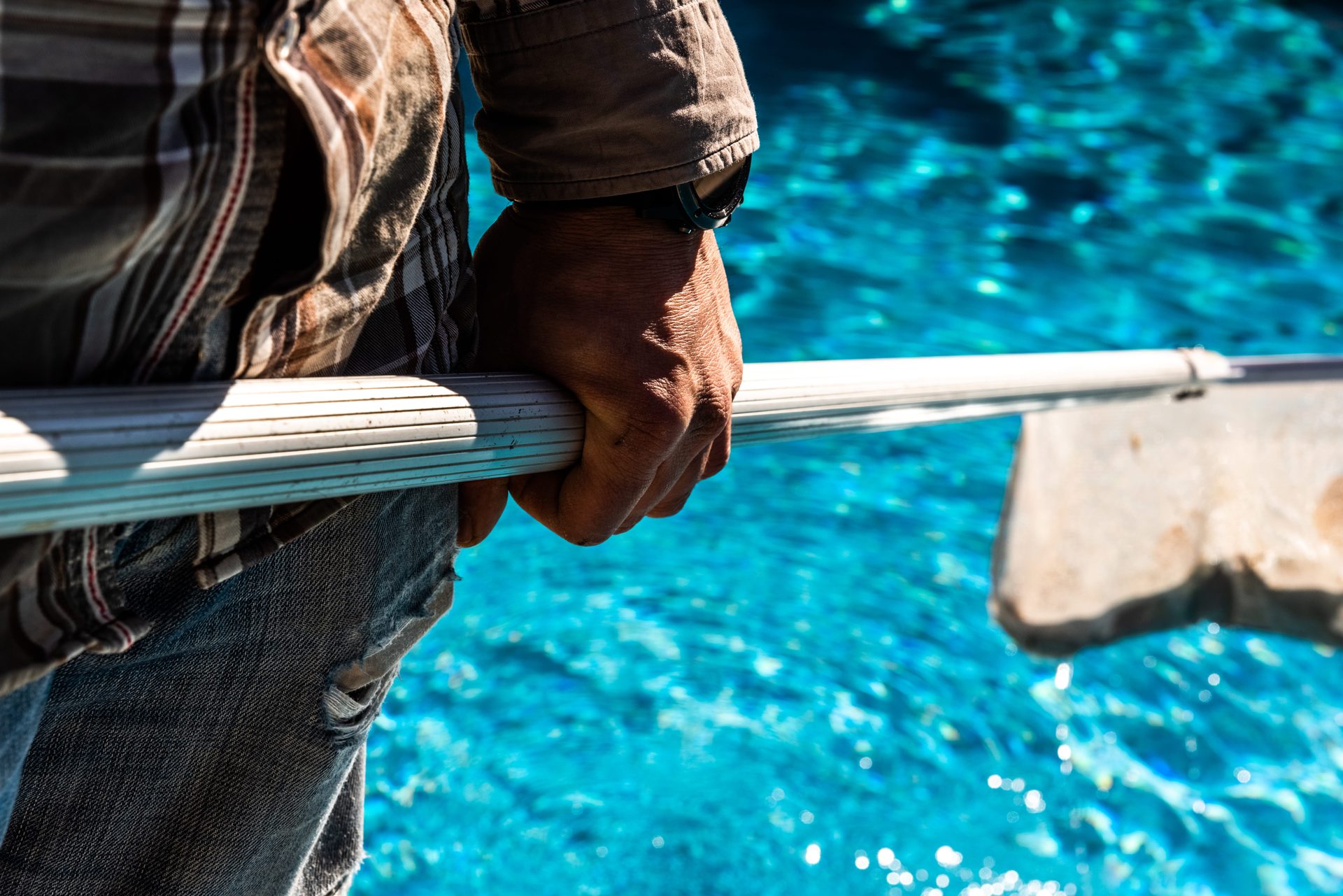 Pool maintenance, skimming and balancing the water